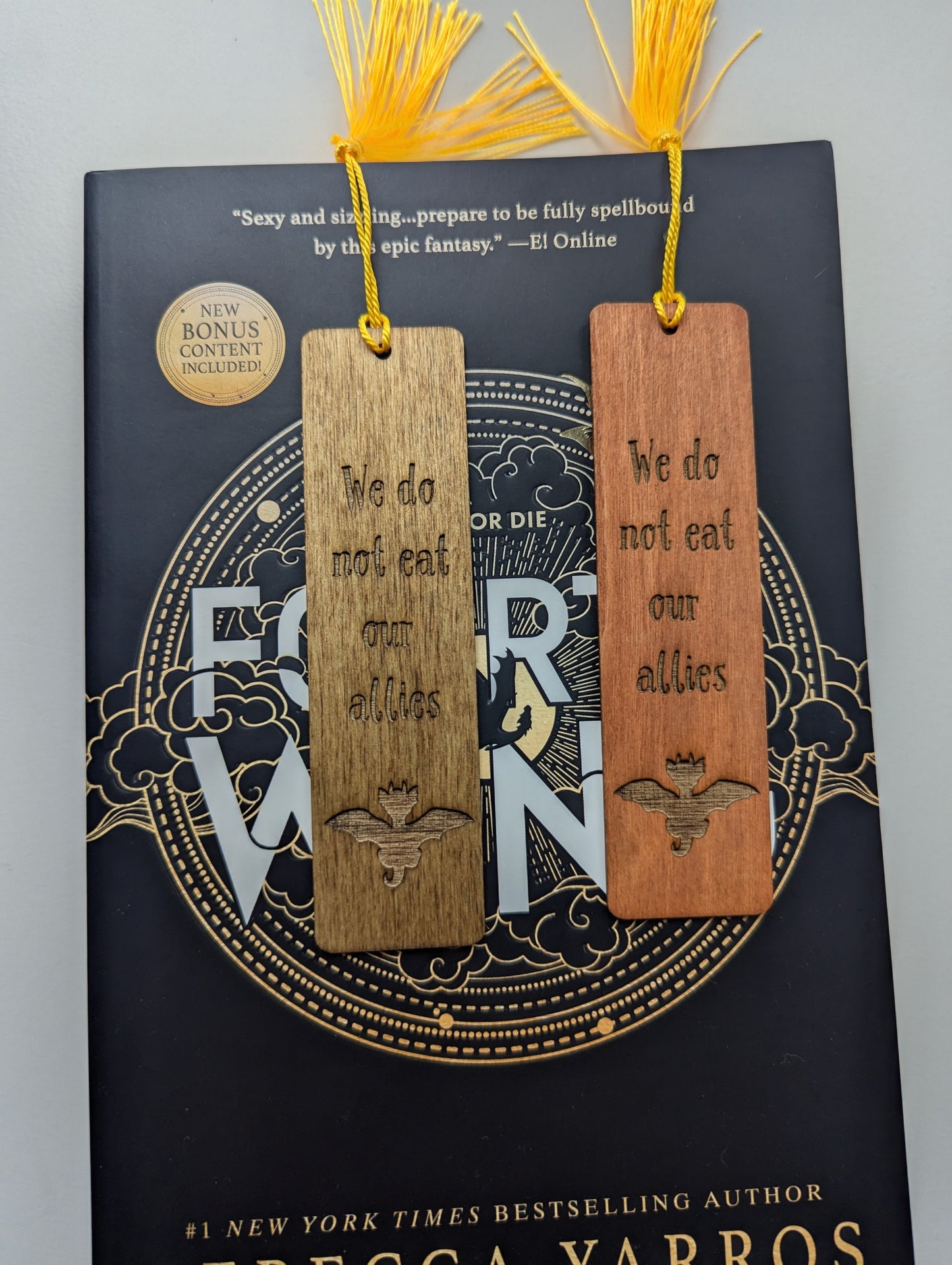 alt="Engraved wooden Fourth Wing bookmark with quote 'We do not eat our allies'"
