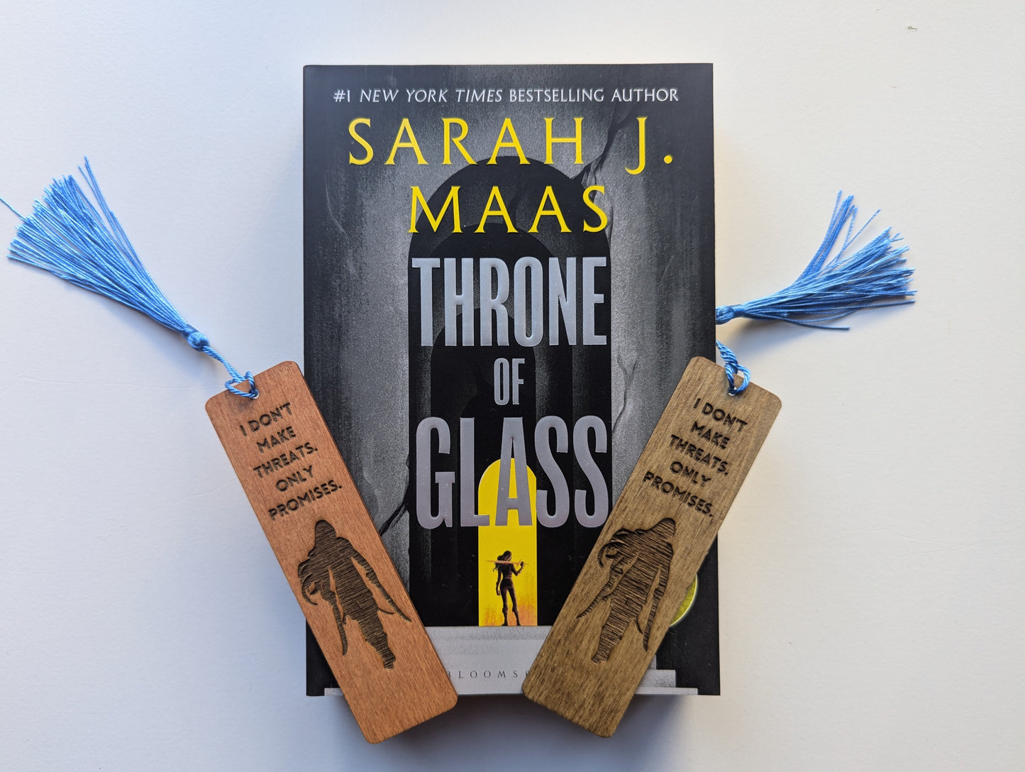 alt="Engraved wooden Throne of Glass bookmark with quote 'I Dont Make Threats Only Promises'"