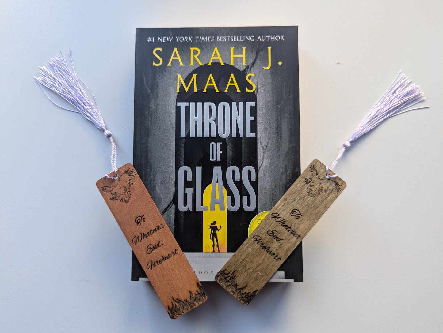 alt="Engraved wooden Throne of Glass bookmark with quote 'To Whatever End'"