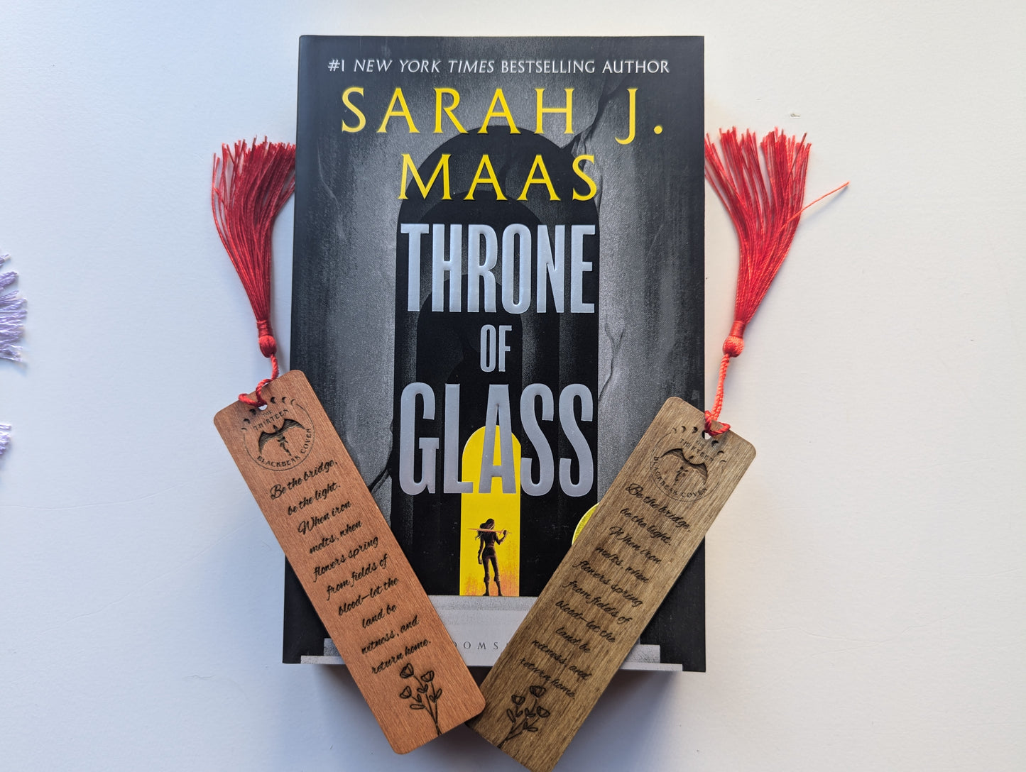 alt="Engraved wooden Throne of Glass bookmark with quote 'Chrochan Curse'"