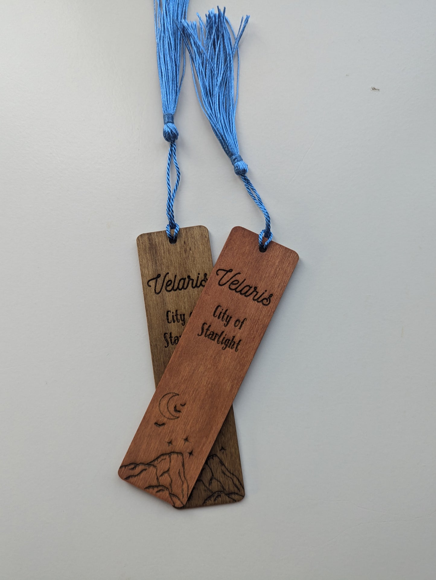 alt="Engraved wooden ACOTAR bookmark with quote 'Velaris City of Starlight'"
