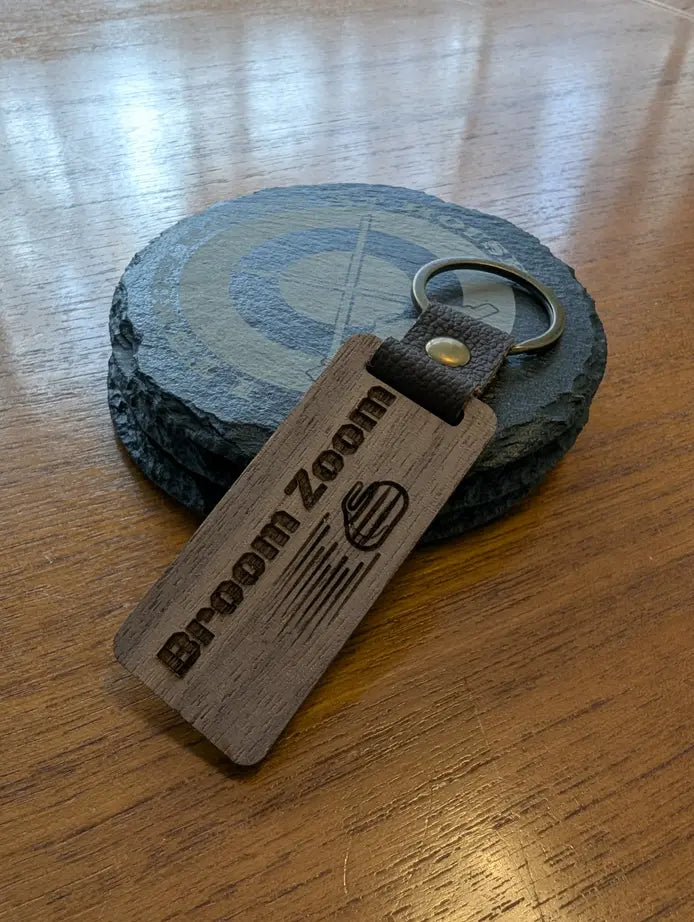 “Broom Zoom” Curling Keychain – Laser-Engraved Walnut Wood Keyring
