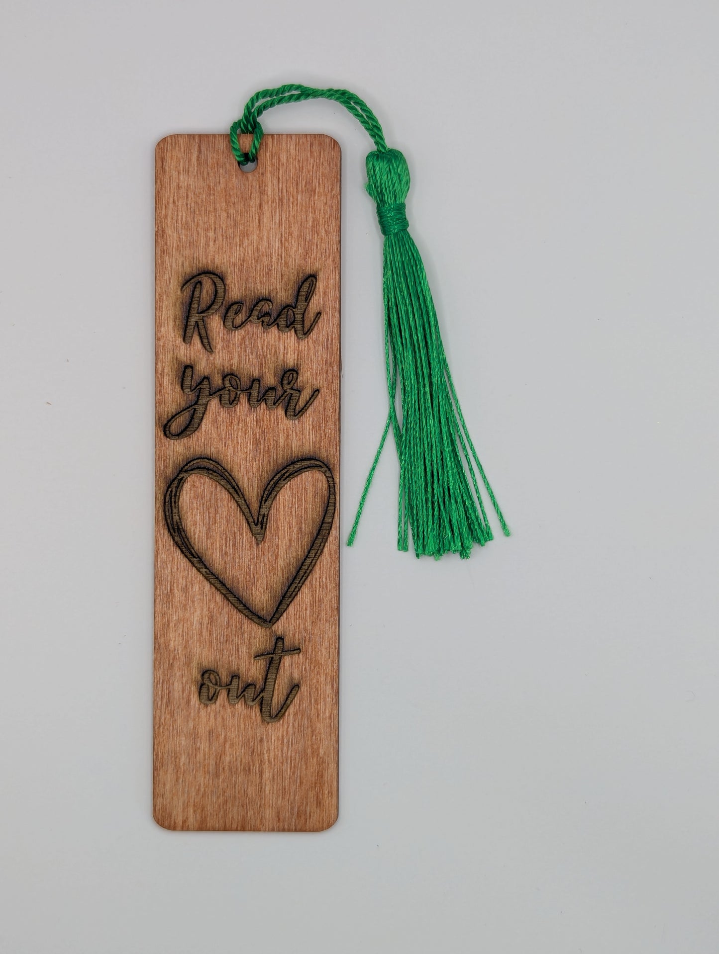 alt="Witty wooden bookmark engraved with ‘Read Your Heart Out’"