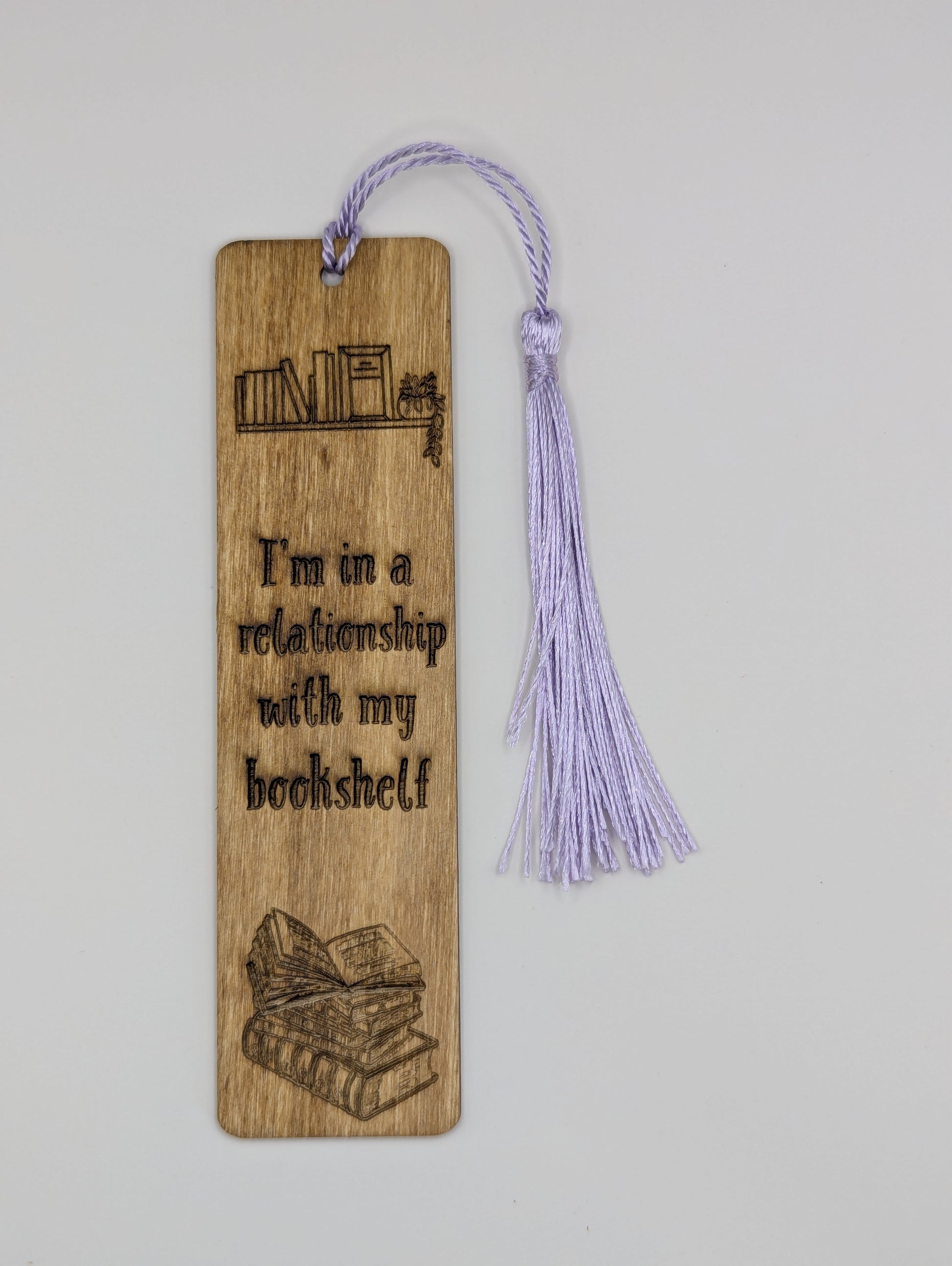 alt="Witty wooden bookmark engraved with ‘Relationship with my bookshelf’"