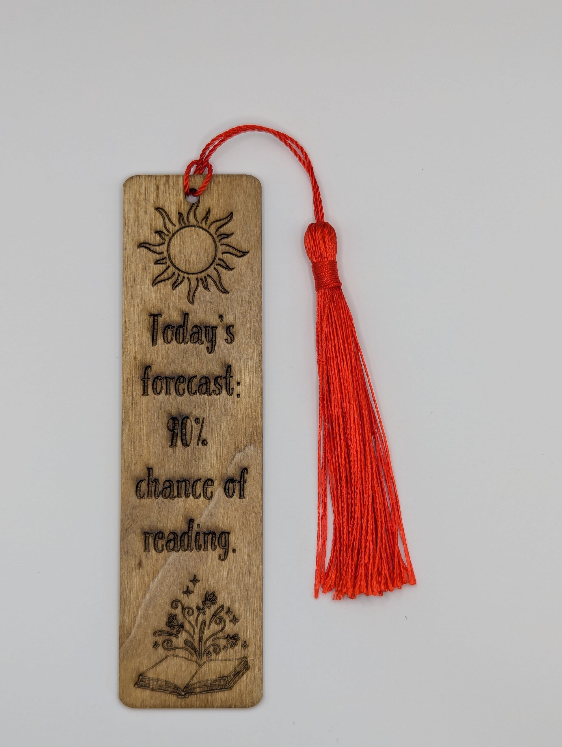 alt="Witty wooden bookmark engraved with ‘90 percent chance of reading’"

