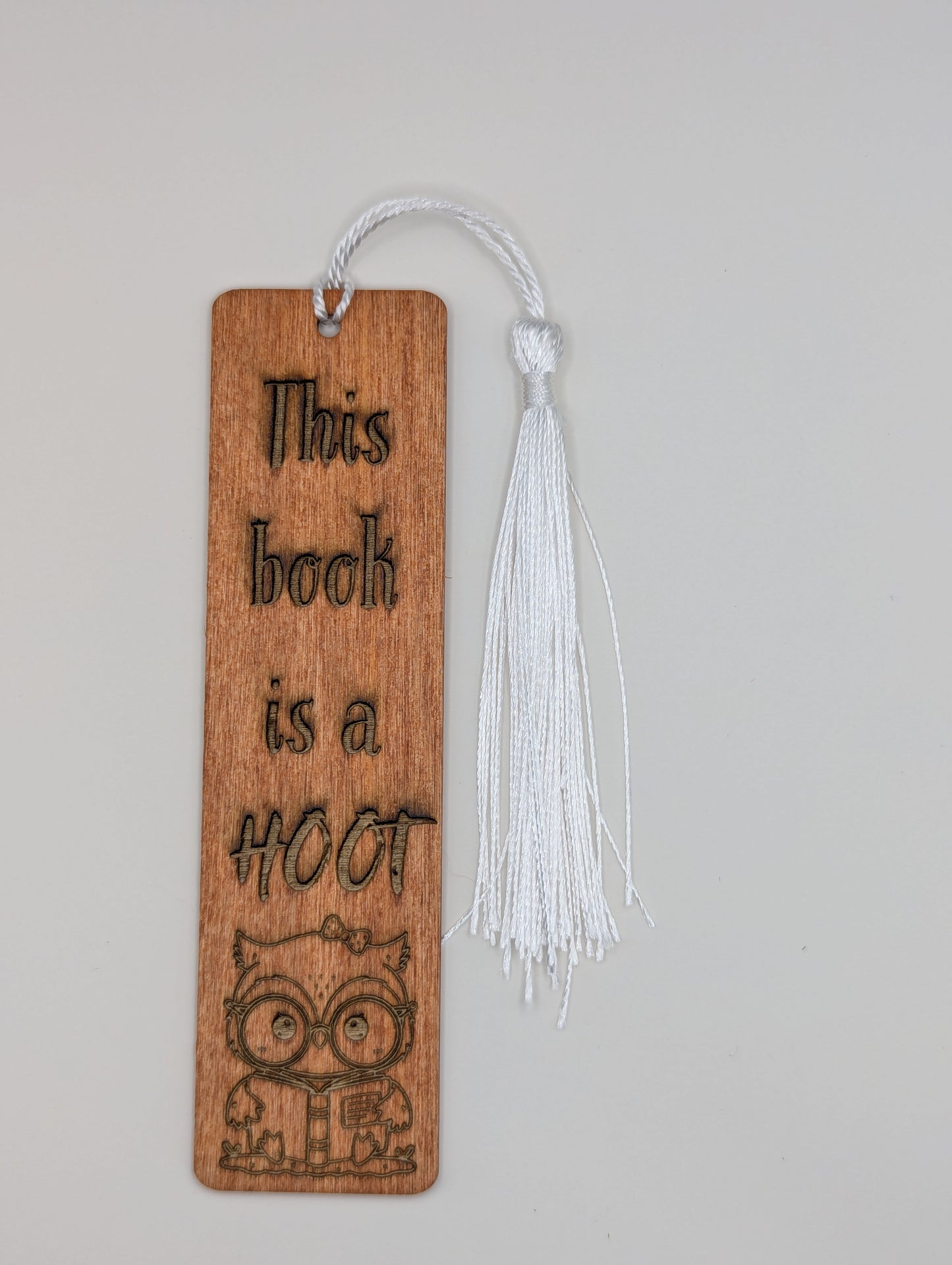alt="Witty wooden bookmark engraved with ‘Book is a Hoot’"