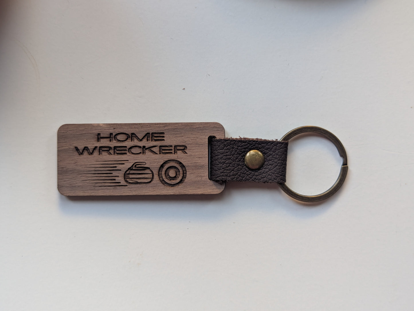 Wooden keychain with 'Home Wrecker' engraving on a white background